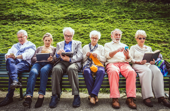 Elderly group sitting on a bench